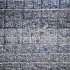 Несколько металлических клеток с камнями, служащие подпорной стеной для трассы, просели — newsvl.ru