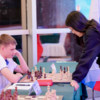 Андрей Тихоновецкий на сеансе одновременной игры с чемпионкой Хоу Ифань — newsvl.ru